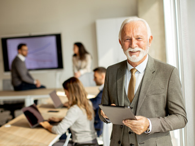 A happy and smiling senior businessman